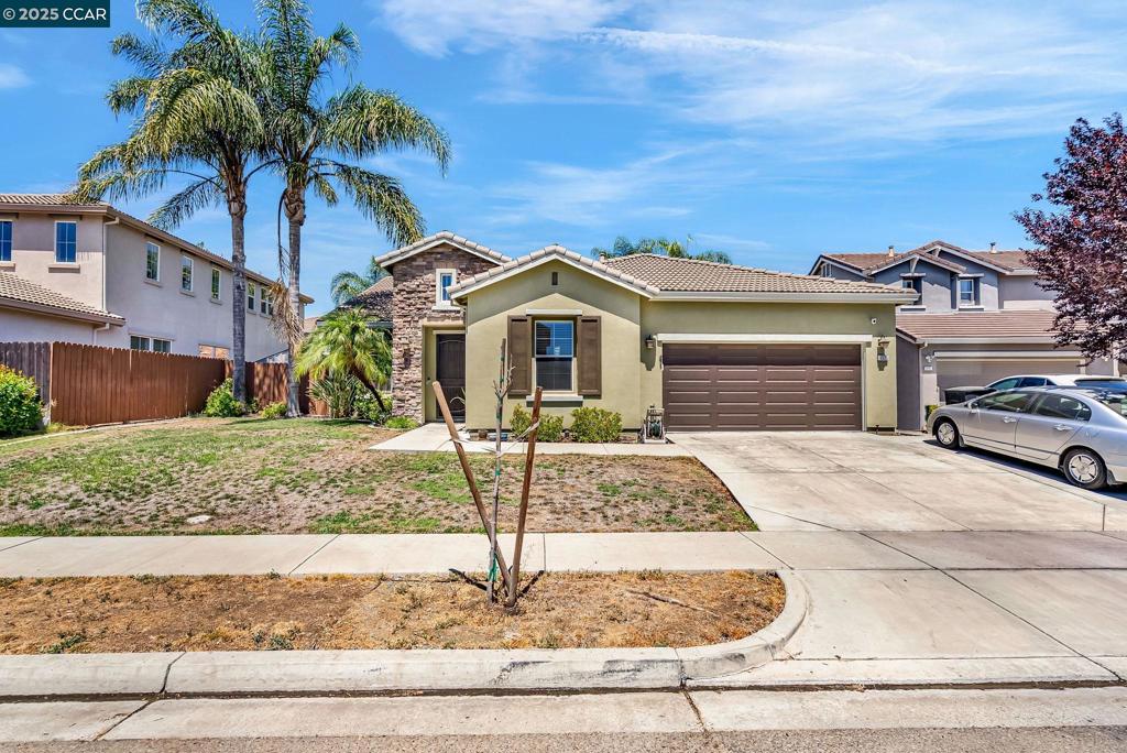 Charming single-story home on a generous lot, beautifully enhanced by palm trees and newly refreshed exterior paint. Inside, enjoy updated carpeting, new water heater, a water softener, and a reverse osmosis drinking water system, complemented by an alarm system for added security. The layout features a front bedroom with a full bath, perfect for guests or in-law accommodations. The kitchen stands out with elegant granite countertops, a tumbled-tile backsplash with an accent row, and stainless steel appliances, including a 5-burner gas cooktop and double oven. An island with a sink and breakfast bar, along with pendant lighting, enhances the space, which also includes a pantry closet and authentic hardwood flooring. The breakfast nook offers extended cabinetry, granite surfaces, a sliding door to the backyard, and more hardwood flooring. The inviting family room features a gas fireplace, built-in entertainment center, ceiling fan with lighting, and 5.1 surround sound speakers. The primary suite includes dual sinks, a makeup counter, a soaking tub, a stall shower, and a spacious walk-in closet. The laundry room provides a 220v dryer hookup, cabinetry, and tile flooring. The front exterior showcases stone accents, shutters, and palm trees, this home is a must see!