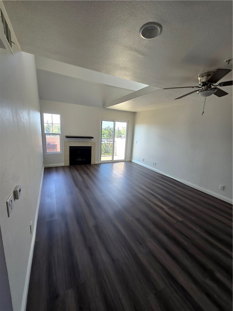 Top floor remodeled condo in gated complex. Enjoy city lights view from balcony off living room. Interior has brand new paint throughout. Primary and secondary bedrooms have walk-in closets. Some of the many features include quartz counters, wood look laminate flooring, stainless steel appliances, ceiling fan, high ceilings, fireplace, jacuzzi bathtub, brand new shower doors, glazed bathtubs. Water utility included in HOA dues. Great location - close to restaurants and shops. Easy freeway access.