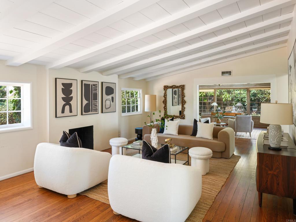 Character defines this Nantucket-style home situated on a flat, almost quarter acre corner lot in coveted Upper Hermosa. Cedar shingles and wood siding with a rich patina set the tone for the craftsmanship within, highlighted by custom built-ins throughout, pegged hardwood floors, detailed dental mouldings and window benches. The kitchen was fully transformed in 2018 with artisan cabinetry, quartzite countertops, Sub-Zero refrigerator, Dacor ovens, and Miele cooktop to create a modern space that enhances the style, functionality and flow. Open-beamed ceilings, clerestory windows and french doors invite an abundance of natural light while seamlessly connecting to the private, verdant backyard with lush landscaping and heirloom fruit trees (mango, pomegranate, fig, lemon, lime, mandarin & avocado). Single-level living with just a few steps throughout, this home has 4 bedrooms & 4 bathrooms, one of which is a perfect guest suite, and magically blends history, charm and modern elements. Located in one of La Jolla's most sought-after neighborhoods with tree-lined curvilinear streets, and walking distance to beaches, the bike path, Bird Rock & The Village!