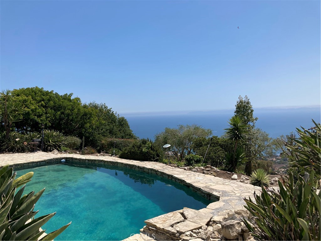 Spectacular PANORAMIC OCEAN VIEWS from this great home sitting atop PV's Nature Preserve in the highly desirable Del Cerro Neighborhood. Catalina sits before you with coves & coastline to the north and south. Virtually every room has an ocean view! The house boasts TWO large Master Bedrooms: one on the Upper Level off the front entry & another Main on the Lower Level (with private access to the backyard and pool). This bedroom has an additional view sitting area for relaxation and the enjoyment of the setting in front of you. Just down the hall are 2 more Ocean View bedrooms & a shared updated bathroom. Bright living room, updated kitchen and dining area/den all on the upper level. There is also a separate dining room off the kitchen with a newly installed wall to wall cabinet. Newer windows, sliding glass doors, cabinets, flooring & fixtures. The outdoor Pool & flag stone patio on almost 1 acre of land enjoy white/blue water views. This is a perfect venue for entertainment. Spacious garage includes a bonus area for possible office/craft room. This home offers privacy in a pastoral setting with staggering coastline views that are unrivaled. PV’s award-winning schools, shopping malls & dining, Terranea Resort & close proximity to multiple golf courses. Pets okay - within reason. WELCOME HOME!