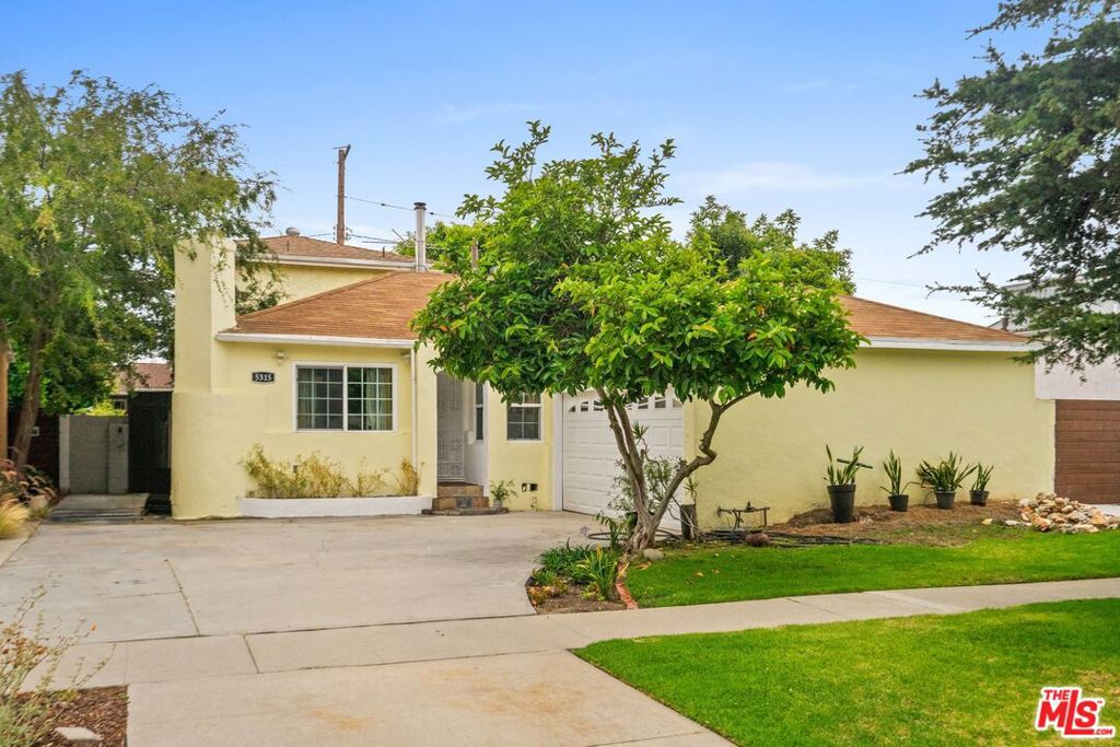 Experience quintessential California living in this sun-drenched, beautifully maintained home, set along a picturesque tree-lined street in the highly sought-after neighborhood of Sunkist Park, Culver City. Making its market debut for the first time in almost 20 years, this cherished residence blends warmth, comfort, and timeless appeal. Enter into the bright and inviting living room, perfect for cozy evenings by the fireplace, or gather with family and friends in the spacious great room that seamlessly flows into the backyard, ideal for entertaining. The versatile floor plan has three ground-floor bedrooms. Upstairs, enjoy the primary bedroom with ensuite bathroom and a charming veranda overlooking the treetops.