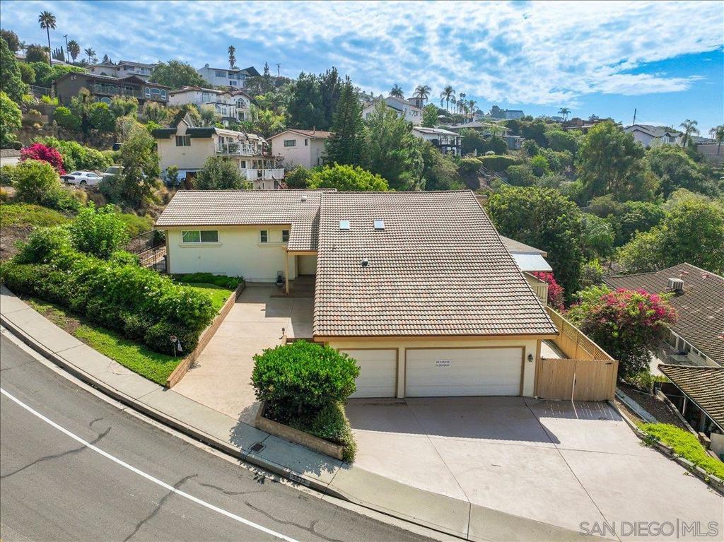 Welcome to 5873 Madra Avenue, nestled in the highly desirable community of Del Cerro. This expansive 3,747 sq. ft. residence sits proudly on a hillside, offering phenomenal views that stretch across the neighborhood and beyond. Just minutes from Lake Murray, top-rated schools, shopping, and convenient freeway access, this location blends natural beauty with everyday convenience. Inside, the home offers a rare opportunity, whether you’re looking to customize and create your dream residence or seeking an outstanding investment property.