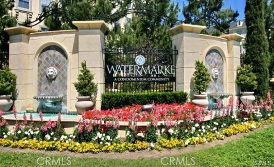 Exceptional living awaits in this amazing top level 2 bedroom 2 bath unit in the Watermarke Community of Irvine. Upon entering this home, you are greeted by sunlight pouring through the open-concept living space featuring a living room, dining room and kitchen. In the kitchen, you'll find quartz countertops, warm cabinetry, and newer appliances. The Primary bedroom suite draws you in with its spacious size, large windows, and view of some of the community's many stunning trees. Attached to the master bedroom is the newly updated en-suite bathroom with connected walk-in closet. On the opposite side of the home is a second large bedroom also with its own attached walk-in closet. Down the hall is a generously appointed second bathroom and laundry room. The amenities of the Watermarke Community abound - featuring secured parking garages, a breathtaking clubhouse, three beautiful pool areas (with spas), theater-style screening room, full gym, and tennis and basketball courts. The Watermarke Community boarders Newport Beach and is nearby UC Irvine, the 405 freeway, many parks, trails and shopping centers as well top rated restaurant's and eateries.