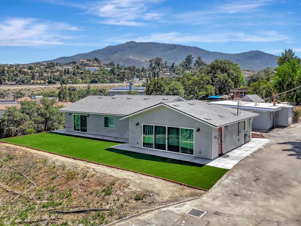 Variance granted Detached. Beautiful Alpine property on just under 1 acre featuring a 1,925 sf main house, an 850 sf 2nd house and a huge, 42’x30’ shop that’s perfect for an RV, car or toy enthusiast. The main house was completed in 2024 and features 3 bedrooms and 3 baths. There are high ceilings throughout the home, a gorgeous modern kitchen, and plenty of windows and large sliders to bring in all of the natural light. The kitchen is wonderful with a large center island, quartz counters and a walk-in pantry with tons of storage. The bedrooms are all spacious with the primary suite featuring a spa-quality bathroom and large walk-in closet. The smaller, second home was remodeled in 2020 and has 2 bedrooms and 1 bath and its own private patio and yard. The shop/garage is massive and there is plenty of driveway space to maneuver an RV or trailer. The property is conveniently located in-town, right off of Alpine Blvd and is close to all of the dining and shopping