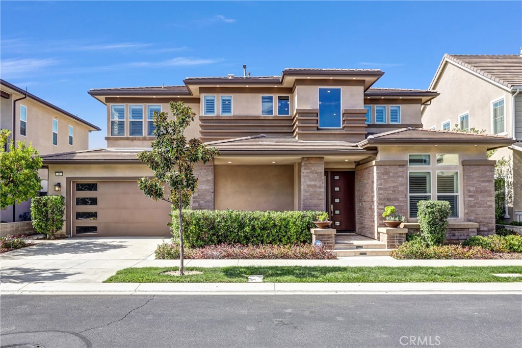 *4BED+Den+Loft* Welcome to this exquisite two-story home located in the exclusive GATED community of ALTAIR. Boasting four bedrooms and four and a half baths, this newly built residence features an open concept design with ample living space for comfort and elegance. The gourmet kitchen is a chef's dream, complete with a walk-in pantry, abundant cabinet space, a large center island, built-in refrigerator, and a 6-burner stove. The downstairs bedroom is ideal for overnight guests, while the den is perfect for a home office. Upstairs, you'll find a spacious loft, a convenient laundry room, two secondary bedrooms, and a luxurious master suite with walk-in closets and a master bathroom with a separate shower and tub. High-end upgrades include hardwood floors, crown molding, and plantation shutters throughout. The professionally landscaped backyard is perfect for relaxation and entertaining. Altair offers luxurious amenities such as parks, community pools and spas, playgrounds, and top-rated schools within walking distance. Conveniently located near the Great Park neighborhood, Woodbury shopping center, Irvine Spectrum Mall, John Wayne Airport, golf courses, and Fashion Island. This property is a "must-see" gem combining luxury, comfort, and convenience.