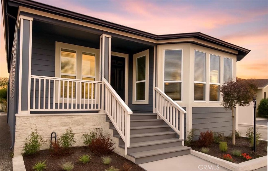 Welcome to Huntington Harbour Village, a vibrant 55+ land-owned community where residents enjoy the benefits of condominium ownership with no space rent. Just minutes from the sand and surf, this beautifully appointed, move-in-ready home offers the perfect blend of comfort, style, and convenience. Inside, you’ll find 3 bedrooms and 2 bathrooms in a light-filled, open-concept design. Soaring 9-foot ceilings and abundant windows create a bright, airy atmosphere, while ocean breezes and central A/C provide year-round comfort. The modern kitchen boasts solid-surface counters, gas range, microwave, dishwasher, and refrigerator- ideal for both everyday living and entertaining. Situated directly across from the clubhouse, you’ll enjoy access to resort-style amenities, including a remodeled clubhouse with catering kitchen, heated pool, spa, saunas, fitness room, game/card lounge, putting green, BBQ area, and RV storage rental. All this, just minutes from Huntington Harbour, Bolsa Chica trails, shopping, dining, and paddle boarding.