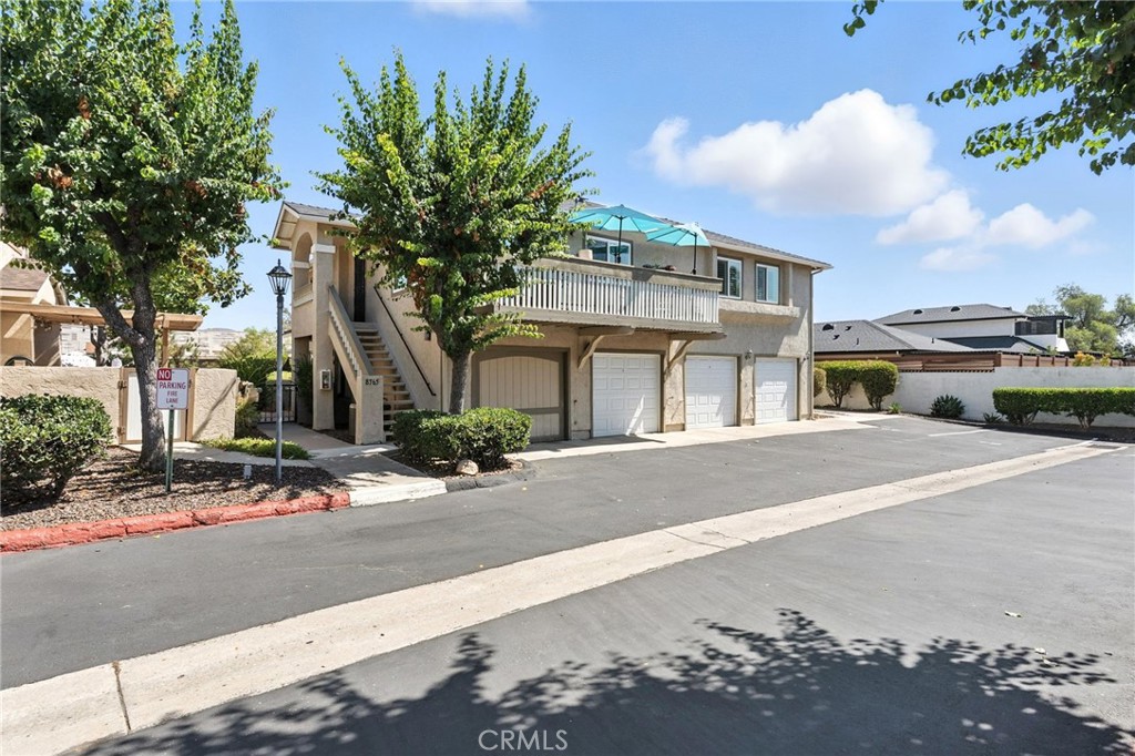 Welcome to Crossway Ct! This charming upper-unit condo is located in the Mission Martinique community and has been recently renovated, making it turnkey. This warm and inviting home features 2 bedrooms, 2 bathrooms, and 945 sq. ft. of living space, along with a one-car garage. The kitchen has been recently updated with gorgeous cabinetry that offers ample storage, including self-closing cabinets and drawers. It boasts modern quartz countertops and stainless-steel appliances, with the refrigerator included in the sale. The kitchen also features a tray ceiling and recessed lighting. Adjacent to the kitchen, the dining area provides slider access to a spacious balcony that is larger than average. Laminate flooring flows seamlessly into the living area. The primary bedroom includes a walk-in closet and an en-suite bathroom with a tub/shower, new toilet, and new fixtures. The secondary bedroom is located across from the guest bathroom, which features a shower and includes a stackable washer and dryer included in the sale. Additional upgrades include new slider and dual-pane windows throughout, new plantation shutters, and a new HVAC system. The one-car garage is directly below the unit and has a new garage door. The community pool is nearby for your enjoyment. Come check out this turnkey home!