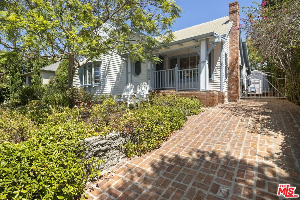 This charming home was extensively remodeled in 2011 and is within close proximity to Montana Ave with it's array of shops and restaurants. Enjoy sunsets over the Pacific Ocean from Palisades Park, or bike along the beach after a hectic day. The living room with fireplace has a vaulted ceiling. The gourmet kitchen with granite counters, stainless steel appliances and a center island is adjacent to the dining area. A large family room with high ceilings opens through french doors to the expansive deck with trellis - a perfect location for al fresco entertaining friends and family. The primary suite features a walk-in closet, a fireplace and an en suite bath with dual sinks, and separate tub/shower. Two more bedrooms complete the floorplan. There is a separate cottage with bath and kitchen. Parking is off the alley behind a gate. Located in the Roosevelt Elementary School district.