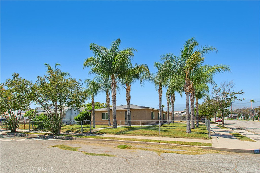 This home offers approximately 1,048 square feet of living space with three bedrooms and one bathroom. The layout is spacious and bright, featuring abundant natural light throughout. The exterior showcases a well-maintained landscaped lot and ample outdoor space, including a spacious yard. Tall palm trees gives that Southern California charm. The fenced perimeter provides a sense of privacy and security. Inside, the home boasts a neutral color palette and tile flooring, creating a warm and inviting atmosphere. The spacious kitchen has been upgraded and is equipped with and ample cabinetry, offering abundant storage, granite counter tops and bright lighting. Room for your larger dining furniture for your family and guests. The primary bedroom is situated where it provides a peaceful retreat, while the additional bedrooms, opposite side of the home, offer comfortable and versatile spaces. Additionally, the roof was replaced in 2024. This home is ideal for those seeking a well-maintained, light-filled living space with generous outdoor areas for relaxation and entertainment. Easy freeway access for the commuter, nearby schools, and shopping.