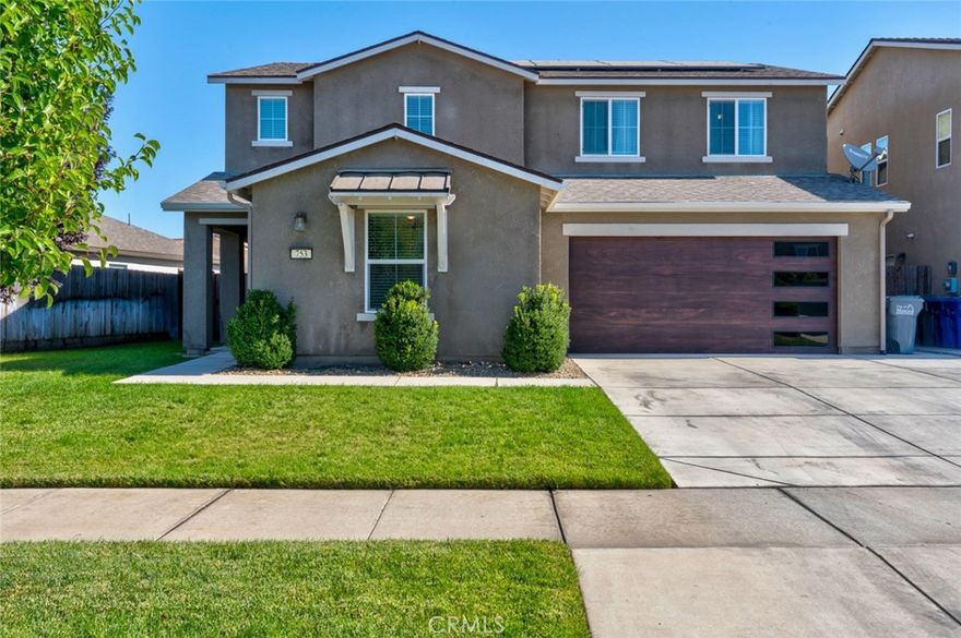 Fall in love with this stunning North Merced home, located near Merced College, UC Merced, local restaurants, and shopping centers! Boasting over 2,500 sq ft of thoughtfully designed living space, this spacious home offers 5 bedrooms and 3.5 bathrooms. Upstairs features four generously sized bedrooms, two full bathrooms, and a large bonus room/loft.  Downstairs, discover a private in-law suite complete with its own bedroom, bathroom, kitchenette, and separate entrance, providing flexibility for guests or extended family. You’ll also find a convenient half bathroom for guests on the main level. Step inside and be welcomed by stylish neutral tones and modern finishes. The gourmet kitchen is a chef’s dream with elegant white cabinetry, sleek black hardware, stainless steel appliances, and a spacious island that’s perfect for gatherings. Step outside to your backyard oasis, designed for year-round enjoyment! Enjoy the solar-heated pool, perfect for swimming even beyond the summer months. The covered patio is ideal for entertaining, complete with built-in lighting, a ceiling fan, and an outdoor TV to host unforgettable get-togethers. Additional highlights include owned solar panels, extended concrete, updated garage door and gates. Beautifully maintained and move-in ready, this home is truly a rare find in North Merced. Don’t miss your chance to make it yours!