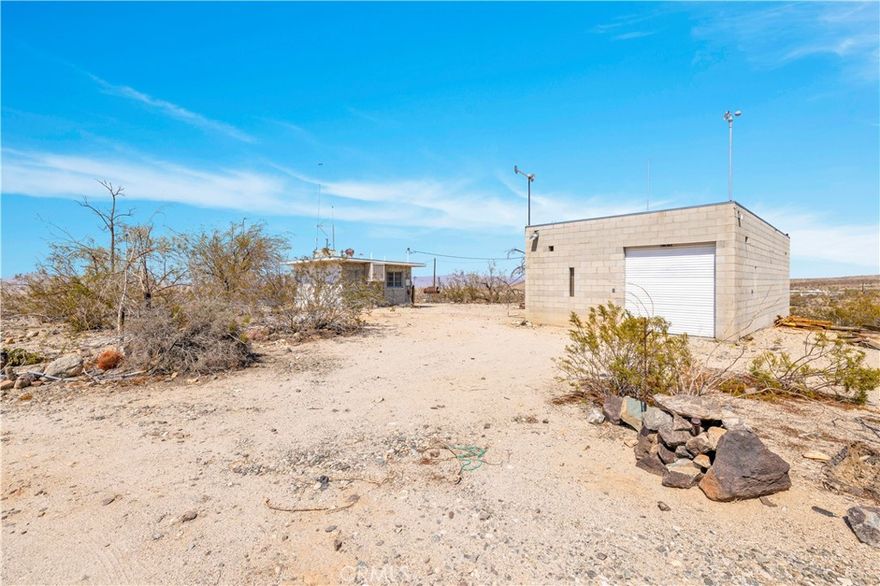 Rare Hilltop Recreational Cabin with City Water & Power on 5 Acres! This is a truly rare opportunity to own a mid-century recreational cabin perched on a scenic 5-acre hilltop with incredible 360-degree views of the desert landscape. What makes this one stand out from the rest? It’s already connected to regular city water and power—a huge advantage for recreational cabins in the area! Built with block construction, this cabin offers classic mid-century charm and the rustic character that so many buyers look for. Inside, you’ll find a functional kitchen and full bathroom, ready for updates or restoration. Whether you're looking to create the perfect desert getaway or a unique weekend project, this cabin has all the potential. Another bonus is the large detached block garage—ideal for storage, a workshop, or conversion into additional space. Please Note: Recreational cabins are not eligible for traditional financing—this is a cash-only sale. This is your chance to own a true desert gem—private, peaceful, and full of potential. Schedule your showing today before it’s gone!
