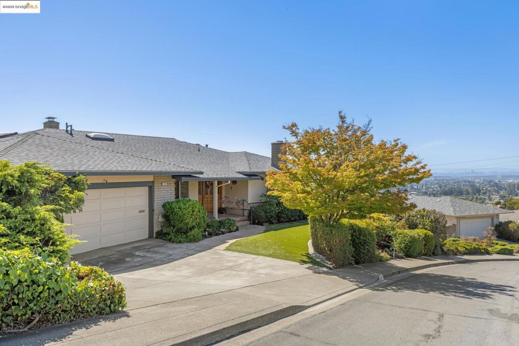 Welcome to this spacious Bay-O-Vista home offering 3 bedrooms, 2.5 bathrooms, and approx. 2,544 sq. ft. of living space on a quarter-acre lot. Perched to take advantage of sweeping Bay views, this property combines comfort, versatility, and a sought-after location. The light-filled dining room easily accommodates large gatherings for holiday meals or special celebrations. The expansive family room features a beautiful vaulted wood ceiling and opens to the backyard. The living room has hosted everything from quiet evenings to milestone events—even a wedding. The backyard is designed for versatility, offering plenty of room for entertaining, gardening, or play. Tucked out of sight is a charming gazebo with a shady garden bench, and a horseshoe area. The mature landscaping creates inviting spaces to relax, sip wine, or simply take in the spectacular sunsets and fireworks displays over the Bay. Inside, the kitchen is a natural heart of the home where everyone can join in meal prep. Features include abundant counter and cabinet space, a center island and breakfast bar and dining nook. The primary bathroom includes a spacious soaking tub with a view of the city lights—an ideal place to unwind. Additional highlights include an attached garage with interior and side yard access Views: Downtown