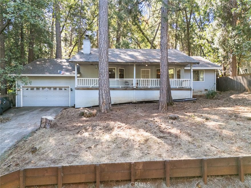 Nestled among the beautiful pines of Magalia sits this charming 3-bedroom, 2-bathroom home that offers everything you need for comfortable mountain living. Step inside and be greeted by vaulted ceilings, stunning laminate flooring, and large windows that fill the space with natural light while framing serene outdoor views. The spacious living room, complete with a cozy wood stove, is perfect for those chilly winter nights in. The open-concept kitchen is designed for both functionality and charm. It features elegant white cabinetry, granite countertops, modern appliances, an electric range, dishwasher, and a quaint breakfast bar that’s perfect for quick meals or morning coffee. When it’s time to unwind, the primary suite provides a peaceful retreat with private access to the backyard, generous space to relax, and an en suite bathroom boasting dual sinks and a large walk-in shower. Additional highlights include a separate indoor laundry room, ceiling fans throughout, a dining area for family gatherings, and an attached 2-car garage. Step outside to the backyard. An ideal place to take in the fresh pine air, host outdoor gatherings, or simply enjoy the sounds of nature. Picture yourself grilling dinner on the back deck, savoring the crisp mountain air, and listening to laughter drift from inside the home. This property offers the perfect blend of comfort, charm, and tranquility. Don’t let this opportunity pass you by!