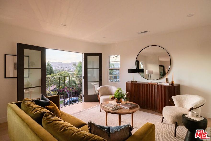 NOW WITH A $300,000 PRICE ADJUSTMENT. A 100% vacant, turn key, and meticulously renovated trophy triplex in prime Silver Lake by AIH Development. Set on a promontory with sweeping views that survey the city, hillsides and landmarks like the Hollywood Sign and Griffith Observatory. The property consists of a duplex with upper and lower unit, and a separate third unit with private side yard. Newly rebuilt in 2025, each unit offers premium design finishes, appliance packages, in-unit laundry, plus dedicated parking. The front duplex offers a lower and upper unit, each with their own entrance. These floor plans feature 2 bedrooms, 2 bathrooms, laundry, and ample living room, dining area, and kitchen spaces. Facing toward the southwest, with romantic French door Juliette balconies, these units receive exceptional natural lighting all day long and offer stunning sunsets, framed by panoramic views of the city. Luxurious amenities catering to high-income renters, like designer tile and stone bathrooms, oak engineered flooring, kitchens with custom white oak cabinetry, eat-in peninsulas and Fisher Paykel and LG appliances. The back third unit lives as a standalone casita with a perfectly proportioned layout, and a private grassy side yard. From stucco to windows, doors, roof, water lines, sewer, electrical, and HVAC, this property has been meticulously rebuilt with energy efficiency, longevity, and ease of maintenance in mind. No expense was spared on the exterior and grounds  with a significant landscaping program, automatic sprinklers, and photocell pathway and landscape lighting. Fully gated for security and privacy, the bricked pedestrian entrance features Door Bird intercom system and the expanded driveway has an automatic gate for ease. A dedicated common yard space offers a green area for tenants to enjoy and unwind outside of their home. Two private garages and one dedicated parking space each feature their own 240v charging portals. Situated in Silver Lake's Sunset Junction, the location is unmatched  with the best amenities in the neighborhood literal steps from your front door - Erewhon, Silver Lake Pool & Inn, Intelligentsia, Bar Seco, Santo, Tartine, Stella, weekly Farmer's Market, Condor, Bacari, and so much more. Rarely do opportunities to own a significantly upgraded and thoughtfully designed multifamily property in an A+ neighborhood become available. See Listing Agent for Offering Memorandum.