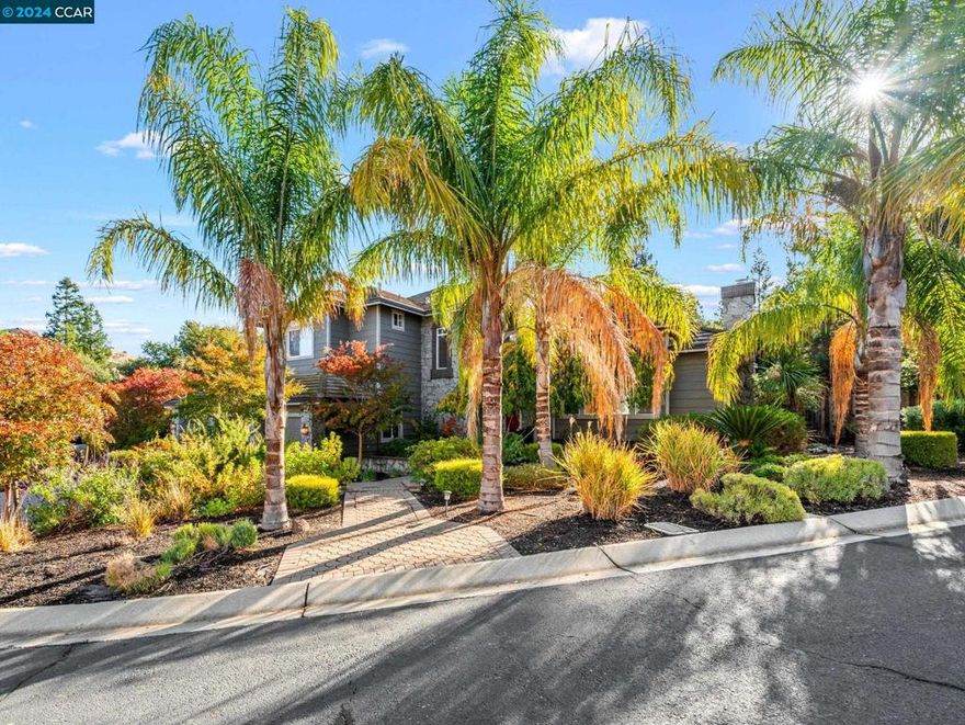 Amazing/Rare opportunity to own a custom built architectural home nestled in Clayton's secluded Oakwood Estates. Step into the dramatic foyer feat a single door flanked by sun drenched side-light & transom windows w/ voluminous ceiling & gleaming hw floors that extend into the elegant living & formal dining rooms. The hardwood floors seamlessly flow into the gourmet kitchen boasting slab granite counters, stainless steel appliances, pantry & casual dining area overlooking the spacious family room with a cozy gas fireplace & sunny sliding glass door leading to deck & paver patio great for dining alfresco. Meandering paths lead to lawn area, pergola covered patio & gently cascading waterfall feature w/ pond.  Meticulously maintained drought tolerant landscape feat towering palms, redwoods, vibrant ornamentals & flowers, extensive use of pavers & stone hardscape set the stage for tranquility & serenity w/ an adjacent seasonal creek adding to the natural beauty of this incredible setting.  Thoughtfully designed w/ convenience in mind featuring a downstairs bed/bath, upper level laundry room, oversized bedrooms & bonus room, + an expansive unfinished under home storage area! This property presents an incredible opportunity for those looking to customize a home to their unique taste.