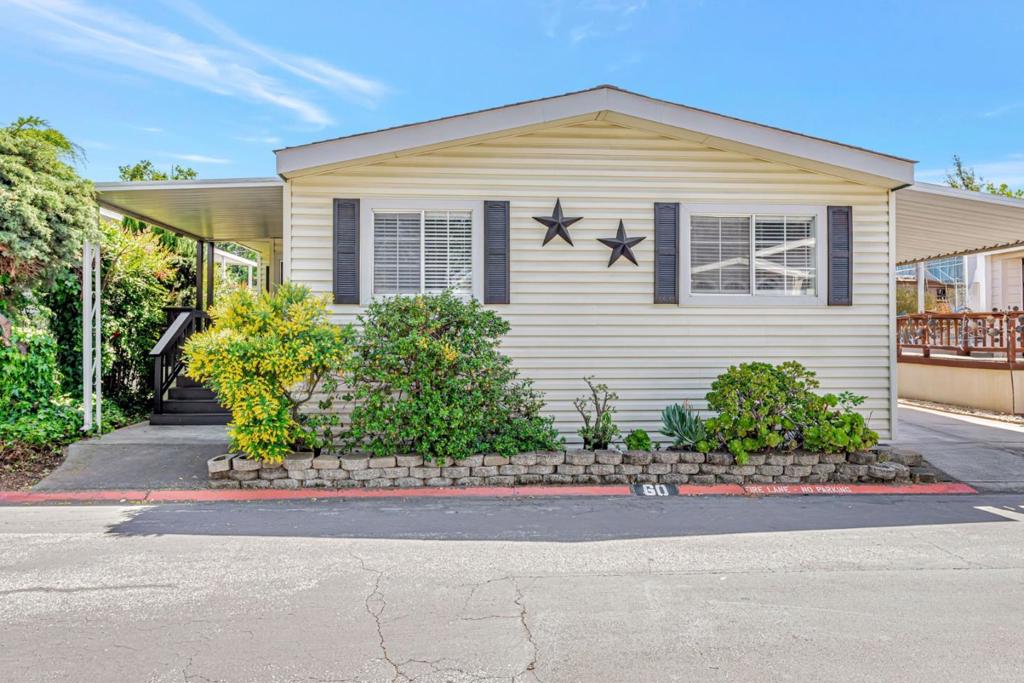 Welcome to this beautifully updated 3-bedroom + den, 2-bath manufactured home nestled in the desirable Mary Manor Estates community. This spacious home offers both comfort and versatility. Step inside to discover a bright & airy split floor plan featuring a skylight, recessed lighting, and a sliding glass door that opens to a private patio. The recently upgraded kitchen boasts quartz countertops, sleek stainless steel appliances, and modern cabinetry, while the rich laminated floors flow seamlessly throughout the home. The primary suite is a true retreat with a custom-built walk-in closet & renovated ensuite bathroom featuring quartz counters, contemporary fixtures & tile surrounds. The second bathroom is equally stylish & updated. Ideally located directly across from the clubhouse, you'll enjoy resort-style amenities including swimming pool, spa, and ample guest parking. Mary Manor Estates is a pet-friendly community situated in the heart of Silicon Valley, surrounded by top tech employers like Google, Apple, LinkedIn & NVIDIA. Easy access to Highways 101, 237, 85 & Central Expressway, while downtown Sunnyvale, Mt. View, CalTrain station, shopping centers & dining are all just minutes away. Located within the highly sought-after Homestead High School district (buyer to verify).