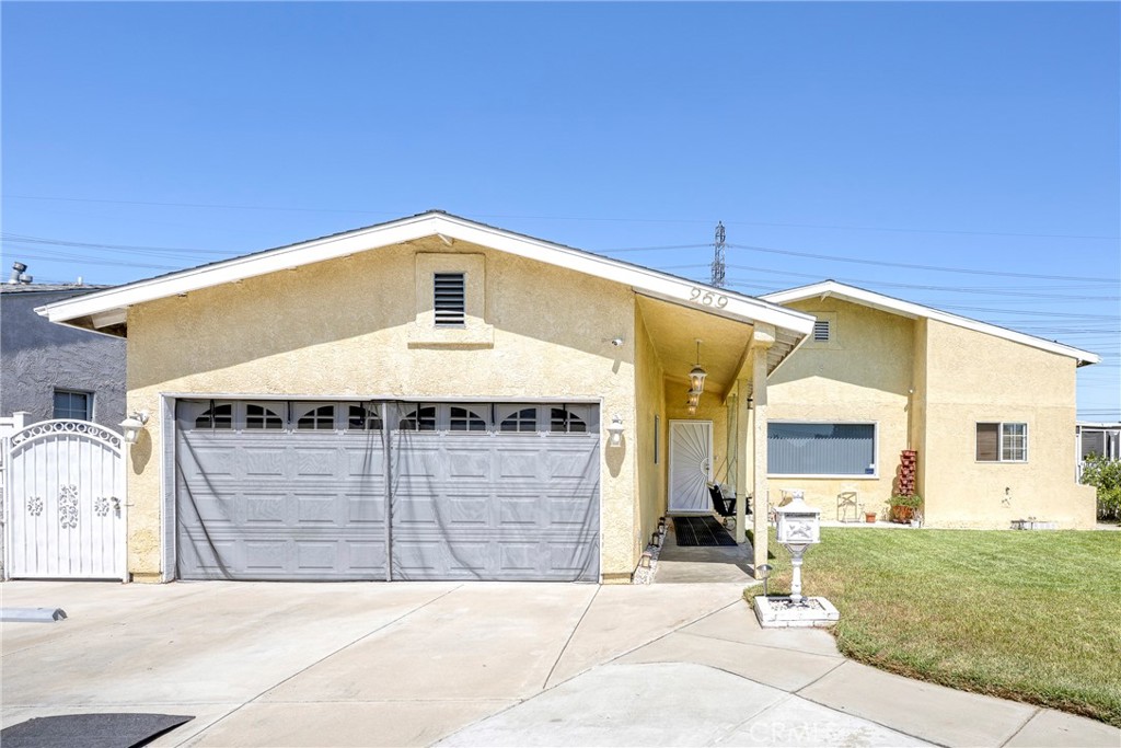 Back on the market! Welcome to 269 E 69th Way in Long Beach, a charming single-family residence. This 3-bedroom, 2-bath home spans 1,713 sq. ft. and sits on a spacious lot with a beautifully landscaped front yard, complete with lush green grass and a welcoming swing by the front door. Originally built in 1949, the home has been thoughtfully updated with a new roof and upgraded plumbing. The gated property provides privacy and security, while the enclosed side yard offers the perfect spot to barbecue or relax in the shade. Inside, the generous floor plan provides comfortable living with room to grow, and the roof added in 2005 with a 40-year-warranty also allows for additional attic space. This inviting home combines classic charm with modern upgrades, making it a wonderful opportunity to own in Long Beach.