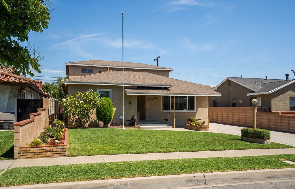 Spacious 6-Bedroom Home with Great Entertaining Space in Azusa!
Conveniently located near the 210 freeway, local parks, restaurants, and schools, this versatile home offers ample living space and plenty of potential for a large family or those who love to entertain.
The main level features a bright living room with a mirrored wall, a large dining room with tile floors, and a spacious family room complete with a wet bar and built-ins. The kitchen offers tile countertops, tile floors and lots of counter space. For outside dinning you have a nice covered patio with a built-in gas barbecue—perfect for gatherings. A large laundry room and additional bathroom are located just off the garage for convenience.
The downstairs includes three bedrooms: a carpeted bedroom with double-door closet and built-ins, a master suite with its own bathroom and shower stall, and a third bedroom converted into a functional office with plenty of built-in drawers. A hall bathroom with a tub/shower completes the lower level.
Upstairs, you’ll find three more bedrooms: one with a closet and carpet floors, another with a bay window, ceiling fan, and dual closets, and a spacious bedroom with four sliding door closets. A large upstairs bathroom with a tub/shower and laminate flooring serves the upper level.
Additional features include some double-paned windows, a large 2 car detached garage, and a long driveway providing plenty of parking. These owners have truly made this a beautiful home ready to move into with new carpet throughout and freshly painted.
This home combines space, functionality, and convenience—all in a great Azusa location!