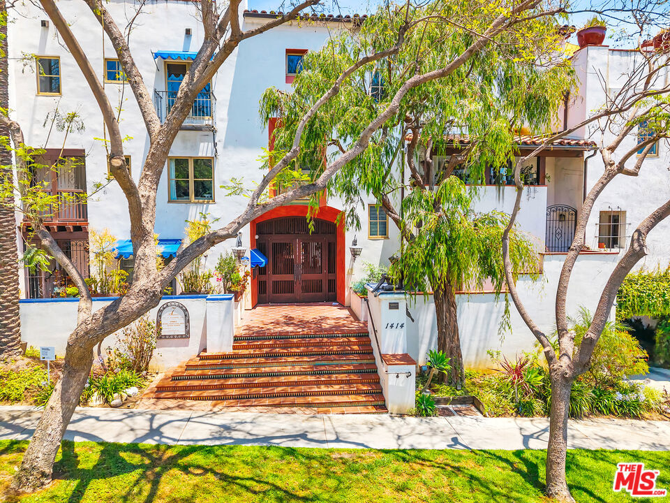 Romantic Spanish revival architectural fully furnished 3 bed/4 bath detached villa townhouse. This is an amazing building with great Hollywood Spanish charm built in 2002. Property features soaring 2-story Living & Formal dining room w/ 25-foot-high ceilings. Very light & bright unit adorned w/ arched doorways & spacious bedrooms lined with original hardwood & Italian tile. Top of the line gourmet kitchen with Viking stainless steel appliances, white Calcutta marble, custom tile back-splash & wine fridge. Spacious top floor master bedroom suite features a fireplace with a large walk-in-closet. Master bathroom en-suite with dual sinks, a deep soaking tub and separate shower. 1st floor bedroom opens up to private patio & can be used as a great office. Private rooftop deck with stone-tiled balcony offers panoramic city views. Great storage space inside the unit. Private laundry room with side by side unit. 2 side-by-side sub parking spots. Brand new AC/heating unit with a smart Nest thermostat. Located a stone's throw from The Chateau Marmont.