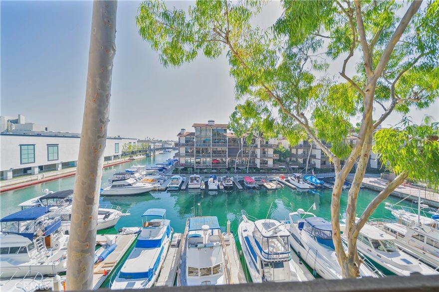 ***BUILDING 15 KEY NORTH***WATERFRONT PENTHOUSE CONDO IN ELITE PRIVATE COMMUNITY AWAITS! Imagine sipping morning coffee on your private balcony as yachets glide past. This rare top-level 2-bedroom, 2.5-bath waterfront unit delivers unobstructed marina views from two private terraces and nearly every window. Tucked inside a 24/7 guard-gated resort community, you’ll enjoy  sparkling pools and hot tubs, a state-of-the-art clubhouse gym, and your own marina just an elevator ride away, all while strolling to upscale grocers, waterfront dining, weekend farmers markets, and sandy beaches without ever starting the car—freeway and transit access are moments away. The HOA covers round-the-clock security, fire/flood insurance, gas, and water, delivering lock-and-leave ease and pure peace of mind. This isn’t merely a home; it’s your front-row seat to Long Beach coastal luxury—move quickly, because this sky-high waterfront gem won’t last.**HOA requires residents to use a parking sticker. Unit comes with 2 designated parking spaces***