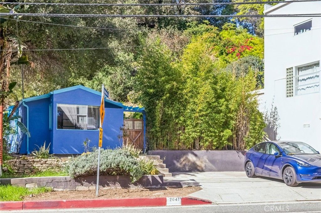 Photo of 2041 N Beverly Glen Boulevard, Los Angeles, CA 90077 (MLS # SB26021919)