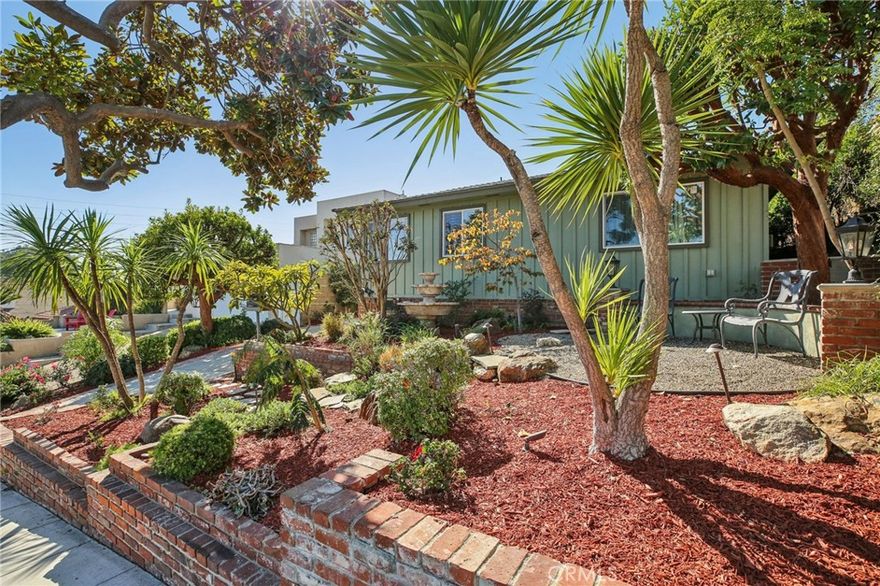 Luxury Coastal Living in Prestigious Alamitos Heights
Experience Long Beach living at its finest at 367 Ultimo Avenue, perfectly tucked away on a quiet, tree-lined street in the coveted Alamitos Heights neighborhood. This exceptional residence sits on a generous 6,693 sq. ft. lot, offering privacy, elegance, and the perfect balance of indoor and outdoor living.
Step inside to discover a designer-remodeled kitchen that flows effortlessly into the family room and den—an entertainer’s dream. The expansive sliding glass doors open to a serene backyard retreat, surrounded by lush greenery and the soothing sounds of a custom fountain. Whether hosting under the stars or enjoying a quiet morning coffee, this tranquil space epitomizes Southern California’s signature indoor-outdoor lifestyle.
The spa-inspired bathroom invites relaxation with its dual vanity, soaking tub, and a luxurious walk-in steam shower. The primary suite is a true sanctuary, offering abundant closet space and a peaceful separation from the home’s main living areas.
A versatile bonus room off the family area adds flexibility—ideal for a home office, gym, or easily converted back to a third bedroom.
Additional highlights include new dual-pane windows, central A/C and heating, and upgraded copper plumbing, ensuring comfort, quality, and modern efficiency throughout.
367 Ultimo Avenue blends timeless design, contemporary upgrades, and an unmatched location—a rare opportunity to own a private retreat in one of Long Beach’s most sought-after neighborhoods.