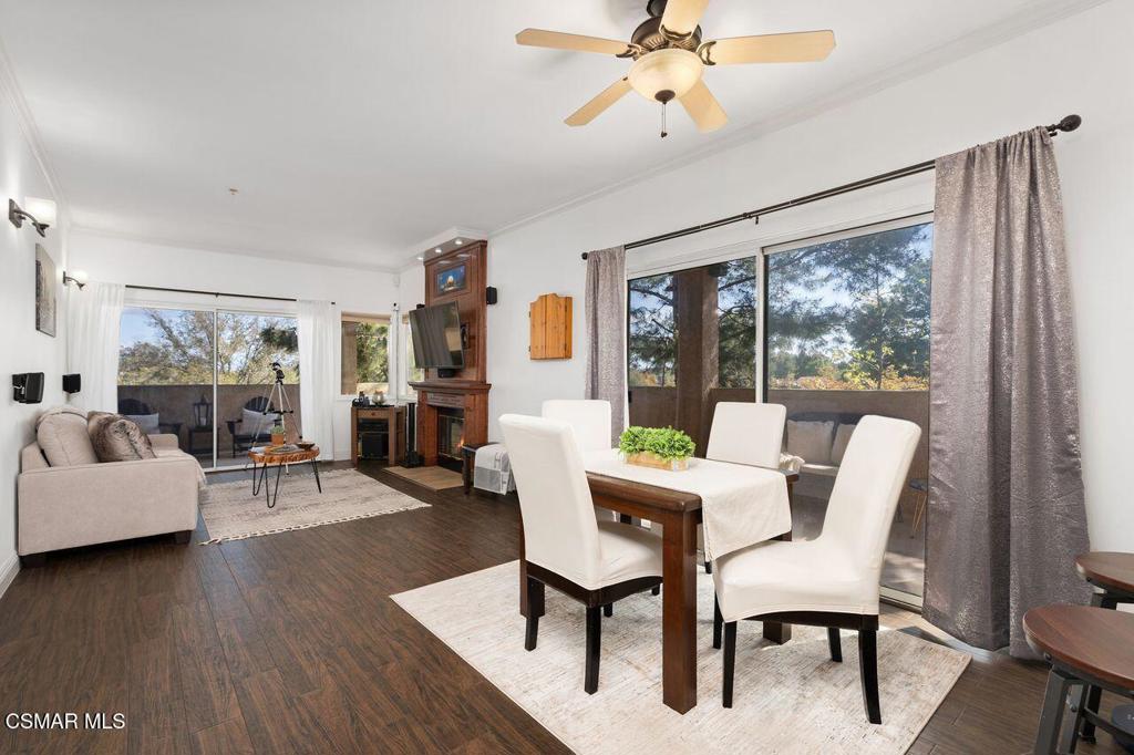 Custom Corta Bella Condo - Come see this highly upgraded, single-story corner condo in the heart of Newbury Park. Offering both comfort and convenience, this well-maintained 2-bedroom, 2-bath home features an open layout, 9-foot ceilings, and abundant natural light from large windows throughout. The beautifully remodeled kitchen includes custom cabinetry, open shelving, lacquered clear-gloss wood countertops, a stainless sink and appliances, and thoughtful extras like toe-kick pull-out drawers, a hidden trash cabinet, spice pullout, and full wall pantry. Both bathrooms have been tastefully upgraded with elegant tilework, modern fixtures, and enhanced lighting. The primary suite offers a relaxing retreat with designer wood plank accent wall, custom closet built-ins, and lowered crown molding with ambient LED lighting. Enjoy direct access to the patio for peaceful mornings or quiet evenings. Durable wood-look ceramic tile flooring brings warmth and character to the living spaces, while the cozy fireplace anchors the room with charm.One of the home's standout features is the private wraparound deck--freshly painted and ideal for gardening, outdoor dining, or simply relaxing outdoors. Additional highlights include a secure, gated garage with side-by-side parking and extra storage. The Corta Bella community offers a well-equipped gym, spa, guest parking, and HOA-maintained insurance coverage for added peace of mind. A smart, stylish place to call home--close to shopping, parks, and everything Newbury Park has to offer.