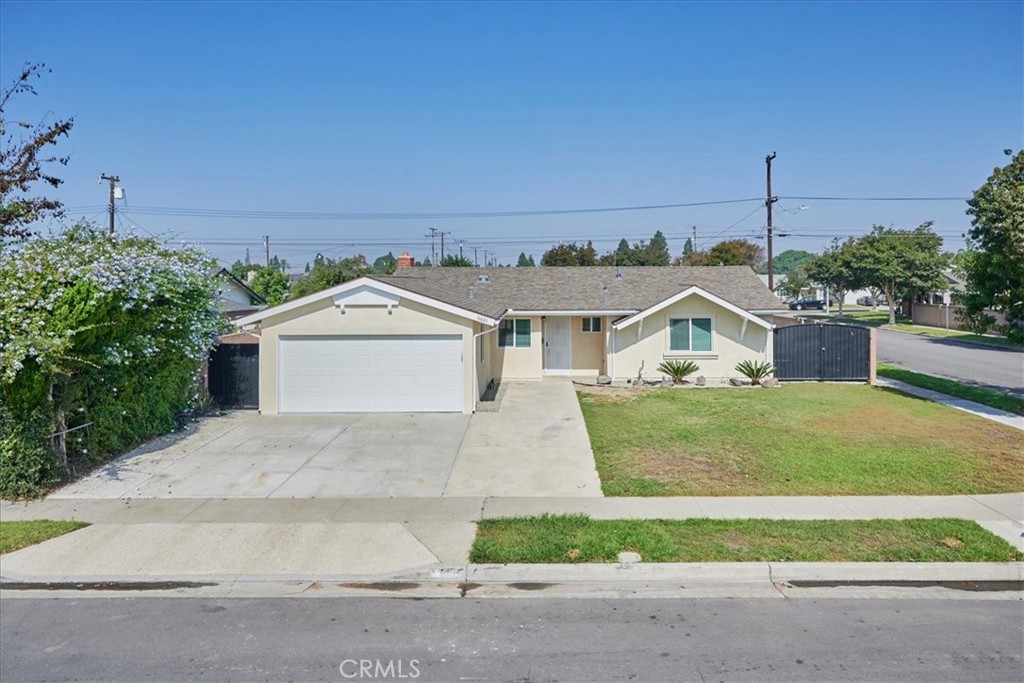 Welcome to this fully remodeled classic mid-century ranch on an oversized corner lot (more than enough space for RV parking)!! Featuring three bedroom and two bathrooms, this gorgeous house has been completely upgraded with beautiful wide plank laminate wood flooring and porcelain tile, cabinetry with stately hardware, recessed lighting and ceiling fans AND refaced wood burning fireplace including a prewired TV port! Entertain in a gourmet kitchen with stainless steel appliances and enormous kitchen island with sit-up countertop! The 2-car garage has direct access with two entrances and an upgraded 220V outlet for EV charging capability! An enclosed "Arizona Room" with separate AC provides an additional 400 sq ft of living space! This home is located a short neighborhood walk to several schools and short drive to shopping, dining and entertainment!