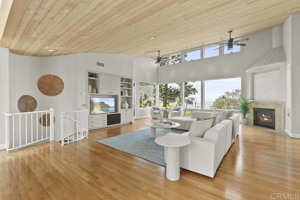 Location, Location, Location. Sweeping WHITE WATER ocean views from the living room, kitchen, and primary suite! Homes lives like a SINGLE STORY, with all living and primary bedroom space on same level as the street and garage. Two balconies to continue enjoying your views outside are also off of the living room. Two additional, large bedrooms and bathroom en-suites are downstairs with access to the backyard. Stunning garden with two spas ideally centered to take in more white water views of the ocean. Moments from the quaint village of Del Mar to enjoy restaurants, shopping and culture. Grab your beach toys and head down for for a day at the beach. This home provides the lifestyle you've been dreaming of!