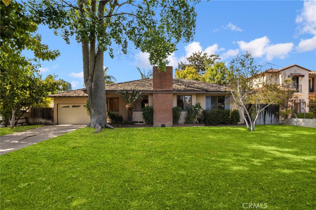 A unique opportunity to own a ranch-style home in one of Arcadia’s most desirable neighborhoods. Situated on an expansive lot, this charming residence offers endless potential to expand, remodel, or build your dream estate in the heart of the award-winning Arcadia School District. A spacious front yard and inviting curb appeal set the tone as you enter this well-designed home. Inside, you’ll find a large living room centered around a beautiful fireplace that provides warmth, while the breakfast nook, dining room, and living room feature gleaming hardwood floors. The large family room, with its cozy fireplace and classic wood paneling, is perfect for gatherings. The dining room also includes a convenient wet bar, ideal for entertaining guests. The galley-style kitchen comes equipped with KitchenAid appliances, offering both functionality and charm. Step outside to a huge backyard with a sparkling pool, providing abundant space for outdoor entertaining, gardening, or future expansion. The lot presents an open canvas to add an ADU, expand the existing home, or design and build your custom dream residence. In close proximity to grocery stores, shops, restaurants, and more, this property combines the best of convenience, lifestyle, and potential. All within one of Arcadia’s most sought-after neighborhoods.