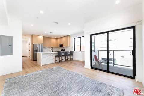Photo of 4615 St Charles Place #1/2, Los Angeles, CA 90019 (MLS # 26838565)