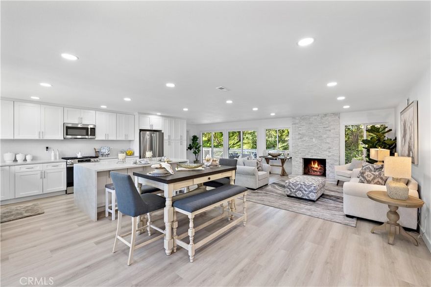 Exceptional Remodeled Retreat on a Private Cul-de-Sac. Welcome to 23902 Via Lugones, a beautifully upgraded custom Elena model nestled in a serene, secluded location on a peaceful cul-de-sac. This thoughtfully remodeled home offers approximately 1,400 square feet of elegant living space, designed for both comfort and style. Featuring two spacious bedrooms, two full bathrooms, and an attached garage, this home is a true gem. Step inside to discover a stunning, open-concept kitchen with a large center island, all-new custom cabinetry, quartz countertops, and stainless-steel appliances, including a brand-new refrigerator. The kitchen flows seamlessly into the expansive living area, creating a light-filled great room ideal for entertaining or relaxing. The primary suite offers a luxurious retreat with a beautifully remodeled en-suite bath, complete with double sinks, a custom walk-in shower featuring multiple showerheads, and a frameless glass enclosure. The second bathroom has also been tastefully remodeled with a new vanity and walk-in shower. Upgrades throughout the home include wide-plank vinyl flooring, LED recessed lighting, new baseboards, mirrored closet doors, and custom closet organizers. Every detail has been considered—from the new doors and hardware to the comprehensive whole-house REPIPED—providing peace of mind and modern convenience. Enjoy indoor-outdoor living with a large, enclosed patio, perfect for quiet mornings or evening gatherings. Located in a premier 55+ community set on 484 acres of rolling hills and mature trees, residents enjoy resort-style amenities including:

Two recreation centers

Pickleball, tennis, lawn bowling & sport courts

Swimming pool, spa & gym

Clubhouse, billiard room & more

HOA-covered front yard maintenance, trash, exterior painting, and common area upkeep. As a member of Lake Mission Viejo, you'll also enjoy access to swimming, fishing, boating, and lakeside picnics.

23902 Via Lugones isn’t just a house—it’s a tranquil, upgraded haven in one of the most desirable 55+ communities. Come experience the lifestyle you’ve been waiting for.