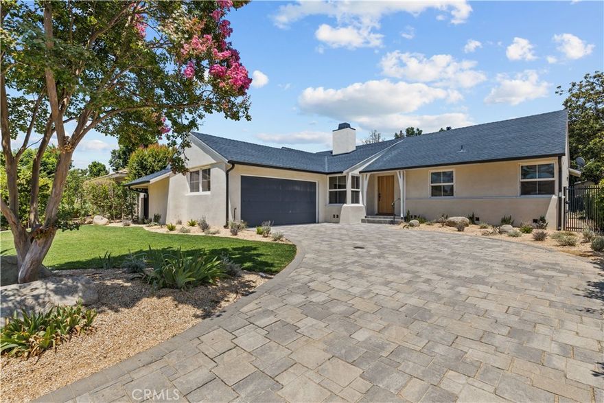 A beautifully reimagined blend of modern design and classic ranch charm, this fully remodeled 4-bedroom, 2-bathroom home is located in a quiet, tree-lined pocket of Lake Balboa. Originally built in 1956 and thoughtfully transformed, the home now offers a bright, open layout with stylish finishes and a seamless indoor-outdoor flow.



The spacious living room is anchored by a sleek double-sided fireplace and opens to the dining area and a newly updated kitchen featuring custom cabinetry, quartz countertops, and stainless steel appliances. French doors lead to a generous covered patio and expansive grassy yard—perfect for entertaining or relaxing in the California sun.



The versatile floor plan includes a dedicated den or flex space with built-ins, and the expanded 2-car garage, once used as an artist’s studio, offers incredible natural light with its north-facing skylights—ideal for creative work, a gym, or ADU potential.



Set on a generous lot in a sought-after neighborhood close to parks, schools, and freeways, this home is the perfect balance of style, function, and location.
