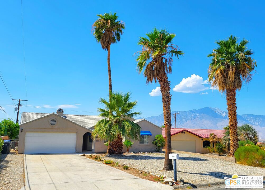 A long term home needs to be in the right place. Consider this upper hillside Mediterranean style Three Bedroom and Two full Bath 1580 SF home as your long term residence. With great curb appeal, desert landscaping, and a panoramic Southern Coachella Valley view from the private feeling rear Yard, you have it all. As you walk up to the Front Door Entry, you find the enclosed front Patio that is perfect for that morning brew or evening drink as you gaze at the soft North Hills. A sweet stained glass window greets you as you come through the Front Entry Door that leads to the Living, Dining and Kitchen area that gives a great room vibe. Curved walls soften the Public Rooms' aspect, while a mantled gas, glass enclosed Fireplace is a central piece. High vaulted ceilings make it feel even roomier, and a Slider Rear Entry Door and large windows make the best use of the natural Southern light. THe Kitchen has upgraded appliances, with a massive five burner gas Range, SS Dishwasher, and Garden Window for your best herbs and seasonings to grow in. Direct Garage access through the walk-in Pantry and Laundry Room makes bring them in a breeze. The finished two vehicle Garage id spacious and finished, with a tiled floor. Note the oversized Hot Water Heater too! On the other side of the home, you have a french-doored Room that gives you a huge variety of uses, including a third Bedroom if needed. The other private amenities have their own side of the home, with a spacious second Bedroom, a separate Full Bath, and a Master Suite with ensuite Bath. New carpets have a deep pile for comfort, and the immense wall closets are mirrored, making the Bedrooms feel huge. The Master Bedroom is ensuite with a luxurious separate soaking tub, curved glass Shower, and dual Sinks. A Rear Slider Entry Door takes you out to the Bedroom's own open Patio area. THe Rear Yard is built for practical use, with a divider cross fencing added at the varied grade. Panoramic views of the West Coachella Valley, Banning Pass, and Mount San Jacinto can be seen from everywhere in the Rear Yard. All this makes it nice for furry children, which are allowed in the Lease (submit Pets information when applying). From front to back, you have high levels of finish, and a home you can relax in and feel comfortable, secure and delighted about. You are just minutes away from shopping, restaurants, and so many other amenities, Desert Hot Springs has many operating natural Mineral Springs water spas, most with day passes, so you don't have to worry about pool maintenance. Come join a community that is lively and available, and come home each day to your comforting nest. Welcome Home!