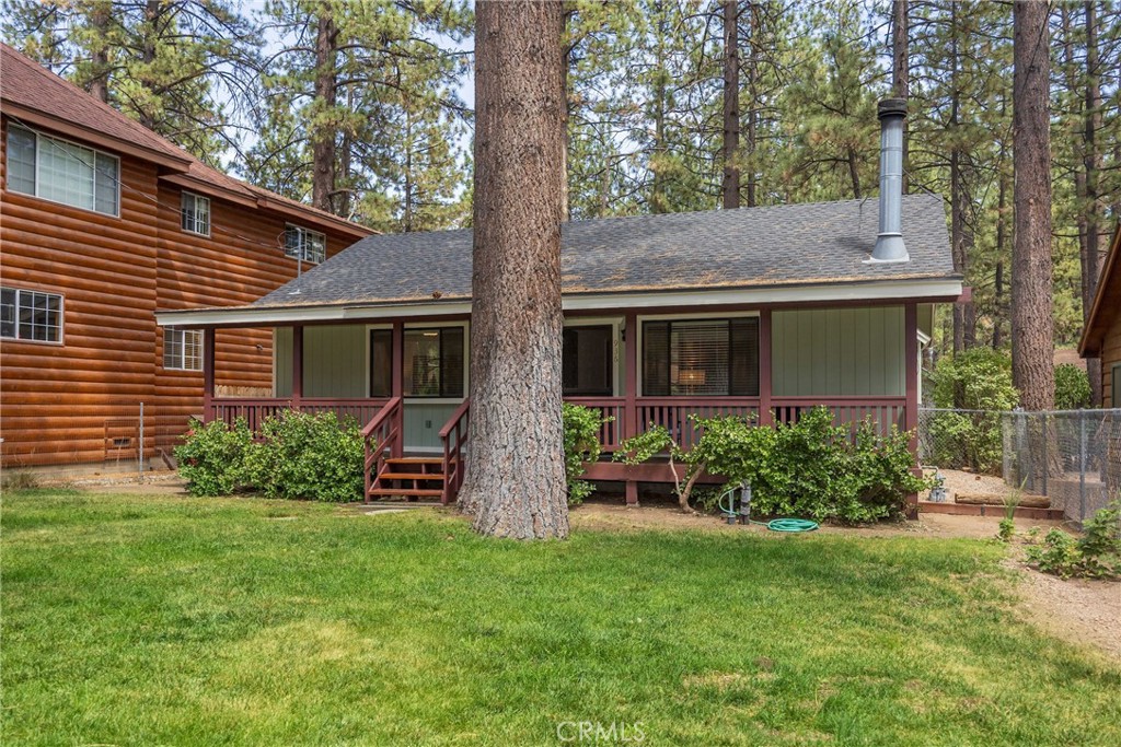 Great Curb Appeal and Ready for Immediate Move-in!
This 2 BR/1 BA/936 sf single story home in the desirable "Peter Pan" neighborhood of Big Bear City has been freshly painted inside and out, including newly stained front and rear decks. New wood laminate flooring and carpeting, new ceiling fans and light fixtures. The raised hearth brick fireplace is the heart of the home and will bring warmth, comfort and memories throughout those cold Big Bear winters.
All kitchen appliances as well as new washer and dryer included. Newer roof. Level 5,000 sf fully fenced lot, asphalt driveway parking with nice landscaping, trees and some privacy screening in the rear yard. Nice neighborhood close to everything in Big Bear! Tasteful furnishings can be included with an accepted offer.