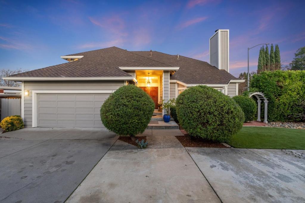 Nestled up against the serene foothills of Cupertino, 7667 Echo Hill Court blends timeless elegance with modern comfort. The well-maintained exterior and mature landscaping provide excellent curb appeal. Inside, a grand foyer with high ceilings leads to a formal living room with soaring vaulted ceilings, large windows, and a cozy fireplace. Adjacent is the formal dining room, perfect for hosting. The gourmet kitchen features modern appliances, ample cabinetry, and a central island. Off the kitchen, a cozy sunroom offers backyard access, ideal for entertaining. The family room provides a relaxing space with direct access to the spacious deck, enhancing indoor-outdoor living. The luxurious master suite includes a generous layout, large windows, and an en-suite with dual vanities, a soaking tub, and a separate shower. Additional bedrooms offer flexibility for guests, home offices, or personal retreats. The beautifully landscaped backyard features a spacious deck, lush greenery, and mature trees, creating a private oasis perfect for relaxation and gatherings. Located in a highly sought-after neighborhood, this home offers access to top-rated schools, including Monta Vista High, Kennedy Middle, and Lincoln Elementary.