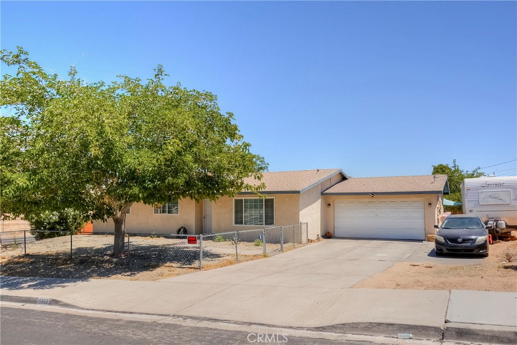 Welcome to this beautiful single-story home on a quiet cul-de-sac in Victorville. Featuring 3 bedrooms and 2 bathrooms, this home offers a bright, open layout with updated laminate wood-style flooring throughout the main living areas. The spacious living and dining rooms flow seamlessly into a well-appointed kitchen with ample cabinet space and views of the backyard. Enjoy a large, private lot, a covered patio, and room to entertain, garden, or expand. The primary suite includes a private bathroom, while the additional bedrooms are perfect for family, guests, or a home office. Other highlights include central heating and air, and a close proximity to schools, shopping, and I-15 access. Move-in ready with room to make it your own—this is the perfect home for first-time buyers, growing families, or investors.