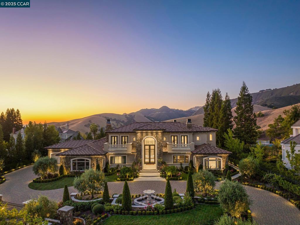 1st time on market. A work of art custom built by owners. A labor of love on top of Blackhawk Country Club’s Eagle Ridge Dr. Bella Diablo Vista gated estate. Award-winning designs, custom-curated features, discerning vision of innovative designers, talented artisans, renowned builders. Tuscan villa meets California’s fresh, light-drenched indr/outdr lifestyle. 1.17+/-acres borders parkland. Venetian plaster walls. Custom quarried travertine flrs inside & out. Soaring coffered ceilings. Custom iron/millwork. Radiant heated flrs. Recessed LED lights. Dual pane Marvin drs & windows. 10,500+/-SF living space. 9383 +/-SF 2-level main home. 5 en suite bdrms. 6.5 bths w/main-level guest suite. 2 staircases. Elevator. Executive office. State-of-the-art movie theater. Climate controlled 1200-bottle wine rm. Formal living & dining rms. Great rm w/walk-around bar. Fam rm. Chef’s kitchen. Dog washing rm. 1138+/-SF 1 bd/1ba detached guesthouse. Infinity-edged pool, spa. Gas frpit. Outdr kitchen. Terraces. 350 Cabernet Sauvignon grapevines. Olive & fruit trees. State-of-the-art security system/cameras. Solar panel system. 5-car garage. Near clubhouses, golf courses, fitness ctr, sprts complex, tennis cts, Blackhawk Plaza,downtown, freeways,Livermore Valley Wine Country,top-rated SRVUSD schls. Views: Ridge