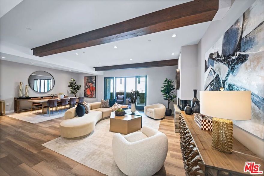 Experience elevated Beverly Hills living at Chateau La Peer, an exclusive collection of 16 boutique condominium residences thoughtfully designed for modern luxury. This second-floor home offers 2 bedrooms and 2.5 bathrooms across an open, light-filled floor plan. The chef's kitchen features top-of-the-line Miele Smart appliances, Italian quartz countertops, Euro-style cabinetry, and under-counter wine storage. European wire-brushed oak plank flooring flows throughout, while expansive windows fill the space with natural light. The serene primary suite includes a spa-like bathroom adorned with Italian Carrera quartz, imported vanities, and a freestanding 66-inch soaking tub.Residents enjoy access to exceptional amenities including a 24-hour concierge, state-of-the-art fitness center, and an elegantly furnished rooftop terrace with panoramic views from Beverly Hills to downtown Los Angeles. Secure underground parking provides two side-by-side spaces for convenience and peace of mind. Located just moments from Rodeo Drive, Robertson Boulevard, and world-class shopping and dining, Chateau La Peer embodies refined European-inspired living at the center of one of the world's most coveted neighborhoods.