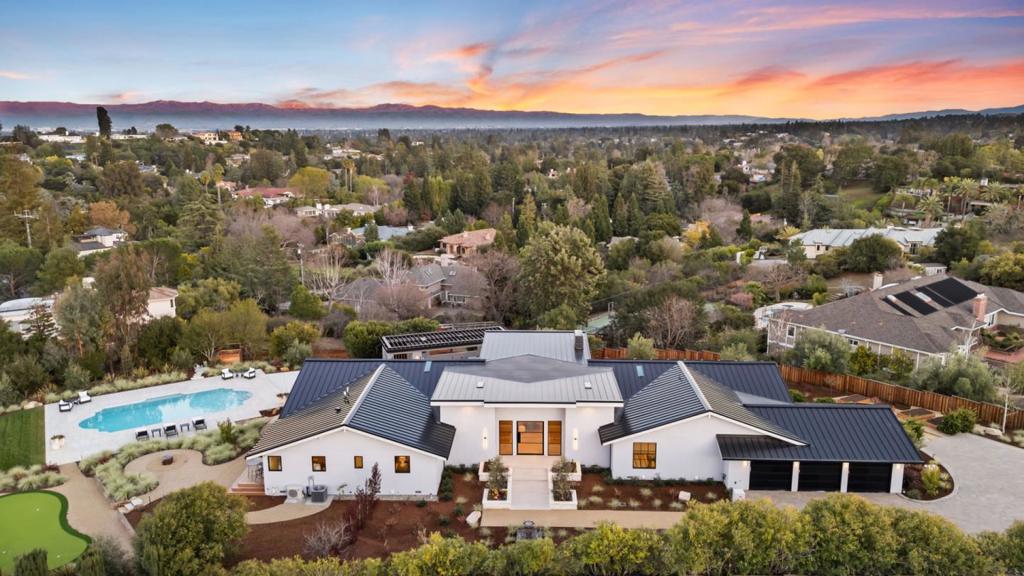 Discover the pinnacle of modern living in this Los Altos Hills masterpiece, where luxury, innovation, and sustainability converge. Nestled on a private cul-de-sac, this home offers a serene retreat just minutes from Downtown Los Altos and Rancho Shopping Center. Full Renovation completed in 2025. This home is designed for eco-conscious living, it features a 10kW solar system with Tesla batteries, EV charging stations, and Heat Recovery Ventilation (HRV) with HEPA filters. Seamlessly blending functionality and elegance, the home boasts multifunctional spaces, including dedicated offices, a media room, attached ADU and a sunken fire pit for entertaining. Additional features include gym, dry sauna, movie/recreation room, and library. Wellness is at its core, with spa-inspired amenities like a cedar sauna, heated bathroom floors, and open indoor-outdoor flow. Cutting-edge technology, from Brilliant light switches to SPAN smart subpanels and fiberoptic ready, future-proofs the home for modern convenience. With sleek, minimalist design, custom finishes, and outdoor luxury features like IPE decks, outdoor kitchen/dining, a heated pool, and putting green, this home embodies Silicon Valley sophistication at its finest.