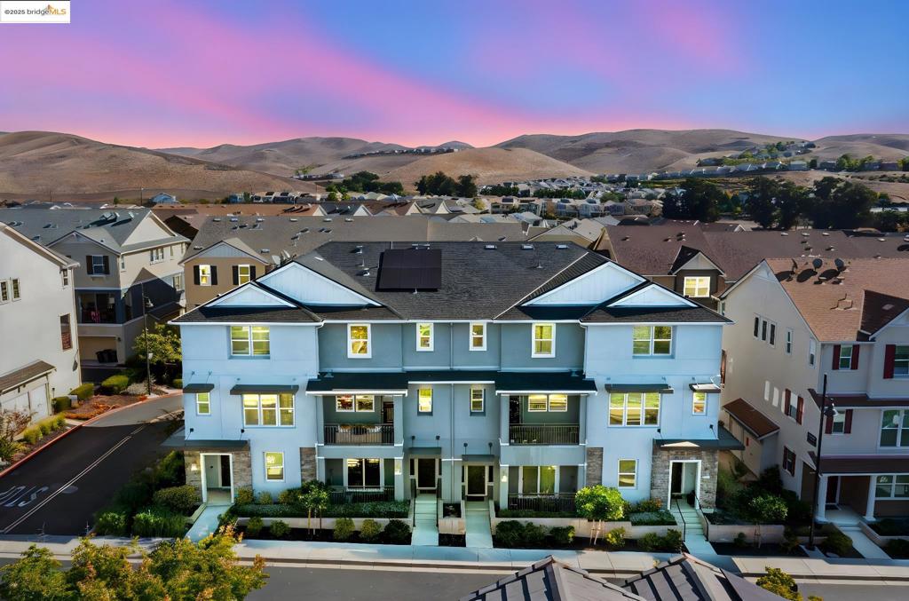 Discover elevated living in this beautifully appointed 3-bedroom, 3.5-bath townhome located in the highly sought-after Wallis Ranch community! Offering 1,962 sq ft of thoughtfully designed living space across three levels, this home seamlessly blends style, comfort, and functionality. Step inside to an open, light-filled layout with soaring ceilings and an abundance of natural light throughout the home. The modern kitchen, open-concept design, and spacious living areas create an inviting atmosphere you’ll love coming home to. Retreat to the luxurious primary suite featuring a generously sized walk-in closet and a spa-like ensuite bathroom – your own personal sanctuary. Enjoy sustainable living with an owned solar system, backup battery power wall, and EV charger – smart upgrades that add long-term value and peace of mind. Just one block away, indulge in resort-style amenities including a clubhouse, fully equipped gym, pool, and a 12-acre park with multiple playgrounds and scenic hiking trails. Wallis Ranch is more than just a neighborhood – it’s a vibrant community with monthly events that bring neighbors together. Located minutes from top-rated Dublin schools, shopping, dining, and major commuter routes, this home offers theperfect balance of tranquility and convenience.