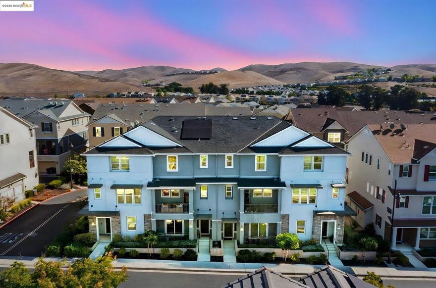 Discover elevated living in this beautifully appointed 3-bedroom, 3.5-bath townhome located in the highly sought-after Wallis Ranch community! Offering 1,962 sq ft of thoughtfully designed living space across three levels, this home seamlessly blends style, comfort, and functionality. Step inside to an open, light-filled layout with soaring ceilings and an abundance of natural light throughout the home. The modern kitchen, open-concept design, and spacious living areas create an inviting atmosphere you’ll love coming home to. Retreat to the luxurious primary suite featuring a generously sized walk-in closet and a spa-like ensuite bathroom – your own personal sanctuary. Enjoy sustainable living with an owned solar system, backup battery power wall, and EV charger – smart upgrades that add long-term value and peace of mind. Just one block away, indulge in resort-style amenities including a clubhouse, fully equipped gym, pool, and a 12-acre park with multiple playgrounds and scenic hiking trails. Wallis Ranch is more than just a neighborhood – it’s a vibrant community with monthly events that bring neighbors together. Located minutes from top-rated Dublin schools, shopping, dining, and major commuter routes, this home offers theperfect balance of tranquility and convenience.