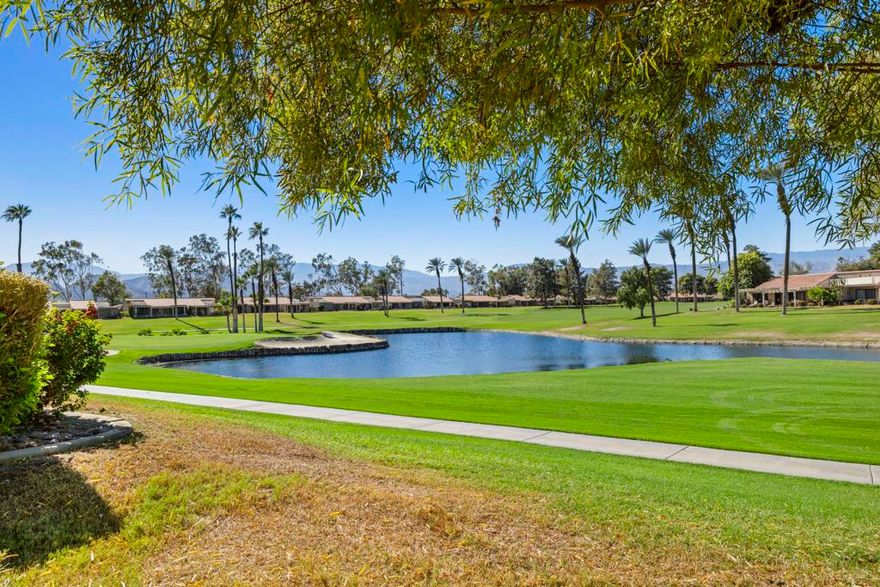 Welcome to Palm Desert Resort Country Club, where resort living meets spectacular views. This beautifully upgraded Augusta model sits on a prime lot overlooking the lake, mountains, and the 6th fairway--one of the community's most scenic settings. The remodeled kitchen features granite counters, stainless appliances, and a refaced fireplace. The primary suite offers dual vanities, a skylight, soaking tub, and separate shower, while the guest bath includes a stylish walk-in shower. Tile flooring flows throughout the home, with carpet in the bedrooms, dual-pane windows, and newer A/C and furnace providing comfort year-round. Located in a 24-hour guard-gated community with 20 pools and spas, clubhouse, golf, tennis, and pickleball available--this home is move-in ready and ready to impress. Photos to come.