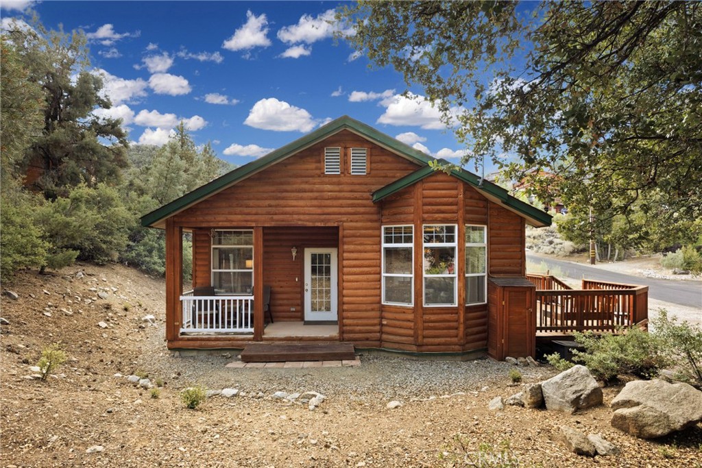 On a sunny corner lot beneath an old oak, 2105 Zermatt Drive offers the kind of mountain living that feels effortless. This single-level home has just one easy step from the front door and hardwood floors that set a warm, inviting tone.
The kitchen and dining area open to the front deck, with a bay window framing views of the trees. In the living room, a stacked stone fireplace and French doors that lead to a private side area of the home—perfect for quiet afternoons.
Both bedrooms have outdoor access, including the primary suite with double closets and its own bath. Modern comforts include central heat and air, an attic fan, a whole-house water softener, a new water heater, and a SimpliSafe alarm system already set up for peace of mind. Outside, you’ll find 220 EV charging, plus a solar system already in place. The buyer will take over the remaining payments, but the rewards are immediate—lower electric bills, and in some months, credits back on electricity.
Flat parking, thoughtful updates, and a true mountain feel make this home both welcoming and practical.
Ownership in Pine Mountain Club includes membership in the Property Owners Association, with dues of $165 per month. This provides access to a variety of amenities: an Olympic-style pool and spa, tennis and pickleball courts, a nine-hole scenic golf course, an equestrian center, and more. The community also offers essential year-round services like 24/7 patrol, trash and recycling pickup, road maintenance, and snow removal. For added peace of mind, Kern County Fire Station 58—equipped with paramedics and a helipad—is located right in the community to ensure fast emergency response when needed.