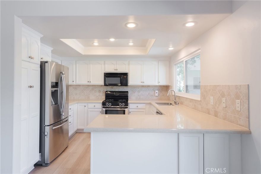 Welcome to 12 Grenada Court in the highly sought-after Manhattan Village – a private, guard-gated community in Manhattan Beach. This light-filled corner unit townhome offers 2 spacious bedrooms and 2.5 bathrooms, blending comfort, privacy, and style. The living and dining areas are framed by abundant natural light, creating a warm and inviting atmosphere perfect for both entertaining and everyday living. Upstairs, you’ll find a spacious primary suite featuring a luxurious bathroom with a soaking tub, dual sinks, and a vanity area, along with an additional bedroom with a ceiling fan and a full bathroom—each space thoughtfully designed for comfort and functionality. Step outside and enjoy all that Manhattan Village has to offer: sparkling swimming pools, relaxing jacuzzis, lush landscaped grounds, walking paths, and 24/7 security. With tree-lined streets, beautifully maintained common areas, and a true neighborhood feel, the Village is one of Manhattan Beach’s most cherished communities. Located just moments from Manhattan Village Mall, The Point, trendy shops, top-rated restaurants, award-winning schools, and pristine South Bay beaches, this home offers the best of both convenience and coastal living. Don’t miss this rare opportunity to rent in Manhattan Village – where charm, community, and lifestyle come together.