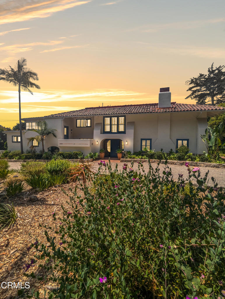 Tucked behind a gated entry on a private acre of park-like grounds, 2607 Puesta Del Sol offers the peace of a retreat in the heart of Santa Barbara.A stone's throw from the Old Mission, the Museum of Natural History, and the winding trails of Rocky Nook Park, this Spanish-style estate blends classic architecture with relaxed, everyday luxury.Inside, 3,700+ square feet of warm, inviting space includes 4 bedrooms (including the studio), a studio suite with its own entrance, full bathroom and kitchenette, 3.5 bathrooms, a beautiful kitchen with a view of the garden and the breakfast nook/family area, a formal dining room, a separate laundry room, and a dedicated office with built ins. A17 foot cathedral ceiling crowns the living room, where a massive stone fireplace and tall windows draw in soft light and frame views of the gardens and mountains. Outdoors, the setting is like a park with complete privacy, mature trees, drought-conscious landscaping, and welcoming spaces for morning coffee, afternoon games of bocce, or starlit evenings in the 8-person spa and cold plunge pool.This fully fenced property also features a soft water system with purified drinking water, and landscape and spa service are included. Pets will be considered.Whether you're entertaining, relaxing, or finding your rhythm in the flow of daily life, this is a home that lives with ease and beauty. Welcome to your Santa Barbara sanctuary.