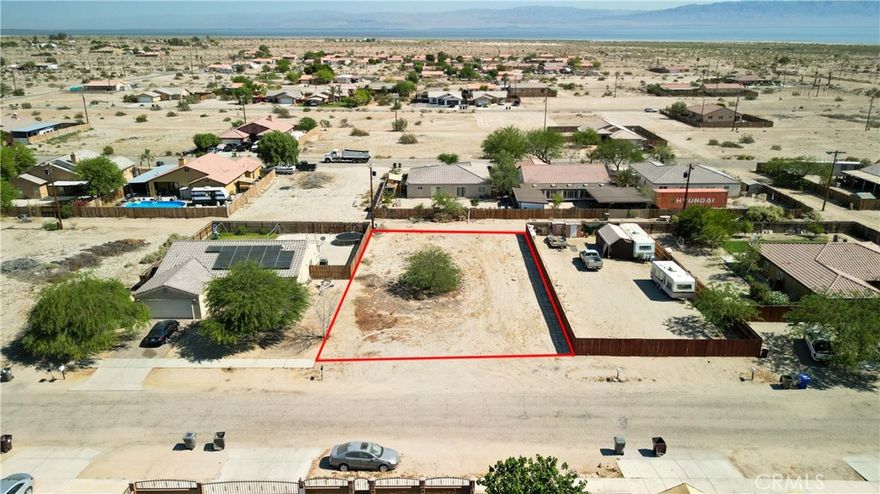 Ready-to-build 0.2213-acre residential lot in established Thermal neighborhood with all utilities at street. Flat terrain, paved road access, just 1 mile from Salton Sea recreation. Full infrastructure includes cable, electricity, phone, public sewer and water connections available. Located in booming Imperial County market with 116% sales increase and median home appreciation of 11.1%. Area benefits from $20 billion Lithium Valley clean energy development launching 2025, creating thousands of jobs and driving property values. Desert views with mature landscaping in well-developed community. Close to shopping, schools, casino, and post office. Premium location offers 348 days annual sunshine, year-round outdoor activities, and proximity to Coachella Valley attractions. Lower IID electric rates and CVWD water service. Perfect for custom home construction or investment in fastest-growing Southern California market. Strategic position between Palm Springs and Mexican border provides excellent accessibility via State Routes 86 and 111. Ready for immediate development with streamlined county permitting. APN 008-634-016-000.