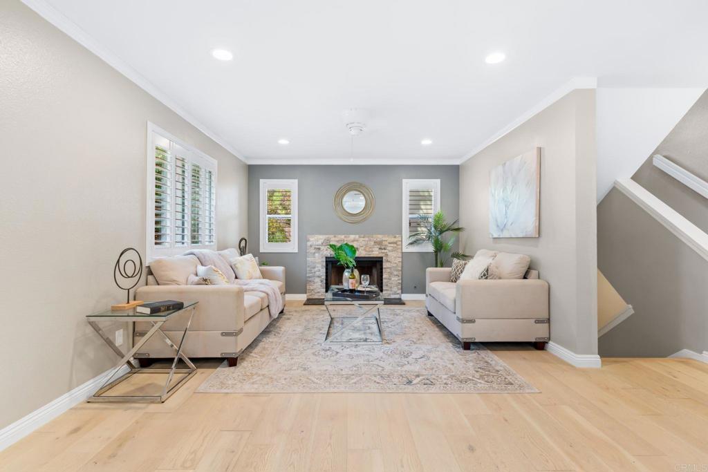 Welcome to this beautifully updated tri-level townhouse in the highly sought-after Hye Park community of Mission Valley. This fully renovated, move-in ready home, features an open kitchen with custom soft-close cabinetry, granite countertops, stainless steel appliances, and excellent storage. This home features hardwood floors that are well-maintained and can be refinished. The spacious living area has abundant natural light and opens to a private patio/deck—newly painted and perfect for entertaining or relaxing while overlooking greenery. Upstairs there are spacious, dual primary bedrooms with blackout curtains, as well as a whole-house/attic fan that keeps the home cool. This quiet back unit is one of only three in the building, making it very private. A very spacious bonus room off the garage provides extra space for storage allowing you to use the garage for cars. Additional features include: shutters downstairs, accordion style blind to cover the sliding glass door, canned lighting, newer dual-pane windows, smart oven, and Nest thermostat. Community amenities include a pool, spa, dog park, and close proximity to Civita parks. The HOA covers water, pool and common area maintenance, exterior insurance, and termites. The HOA also recently had the exterior of the complex painted. The unit also features a two-car garage with direct access and readily available street parking. Excellent location in the heart of San Diego with quick access to shopping, dining, entertainment, and major freeways!!