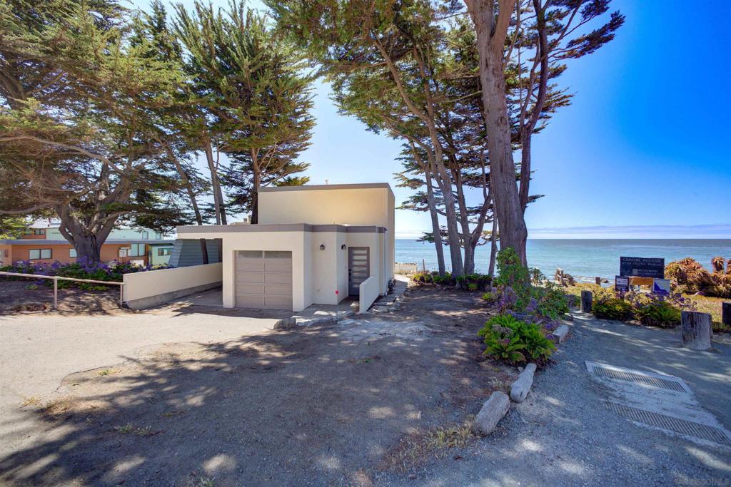 A rare opportunity to own oceanfront property in Cambria—with owner financing available. This two-story coastal gem offers sweeping whitewater views and direct access to the bluff trail, nestled just steps from the 430-acre Fiscalini Ranch Preserve with oceanfront pathways, forested trails, and peaceful meditation benches. The home has been thoughtfully upgraded with a new roof, updated windows, new flooring, a remodeled kitchen, refreshed bathrooms, electrical panel, gas fireplace insert, water heater, washer, landscaping, and more. A converted garage provides additional living space, ideal for guests, a studio, or a home office. Enjoy better-than-180-degree coastal views thanks to the home’s unique position next to public beach access. Expansive panoramic windows capture the dramatic Pacific coastline, filling the home with natural light and ocean serenity. A rare find in Cambria by the Pines—this is your chance to own a turn-key oceanfront retreat with flexible terms and unforgettable views.