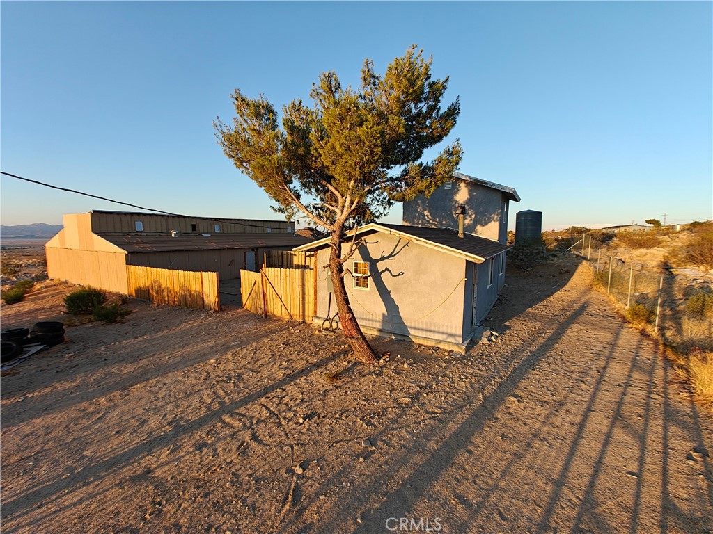 Fixer upper property with a huge barn style additional structure.
